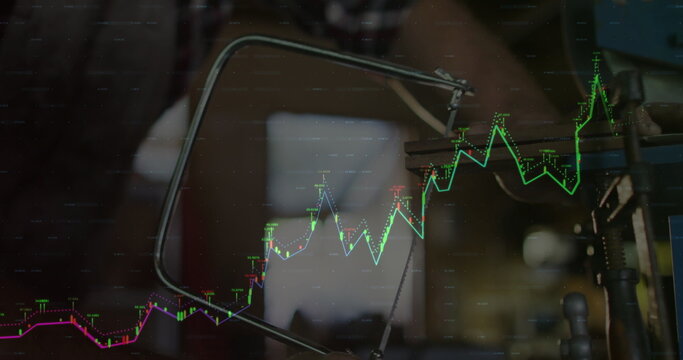 Saw clamp assembly showing blade, arm and tensioning screw in workshop with stock chart overlay