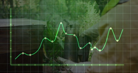 Inspecting beekeeper in suit lifting hive frame in apiary under data line graph overlay, copy space