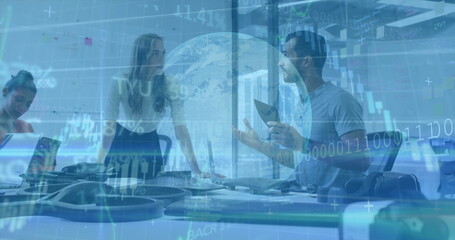 Collaborating three colleagues discussing project at office conference table, with VR headsets
