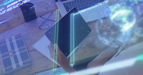 Mature woman analyzing tablet data and scrolling at home office, with notebook, laptop, copy space