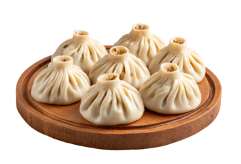 Six dumplings, light beige color, on a round wooden platter
