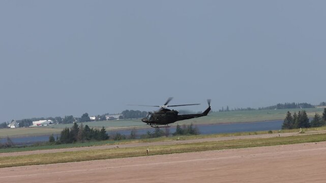 Summerside Prince Edward Island Canada - July 15th 2025 - Canadian Armed Forces CH-146 Griffon Helicopter slow acceleration down runway