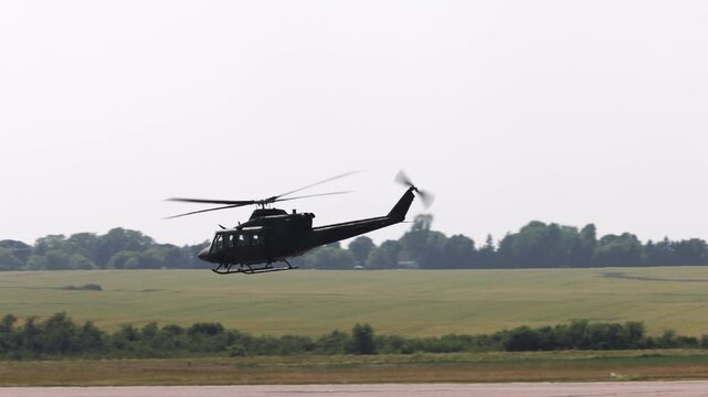 Summerside Prince Edward Island Canada - July 15th 2025 - Canadian Armed Forces CH-146 Griffon Helicopter flying flow with fields in background