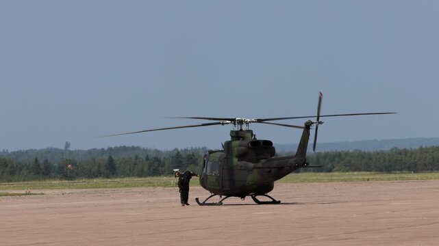 Summerside Prince Edward Island Canada - July 15th 2025 - Canadian Armed Forces CH-146 Griffon Helicopter Pilot inspection