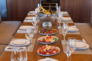 An Exquisite and Elegant Dining Setup Featuring Fine Champagne and Gourmet Culinary Delights