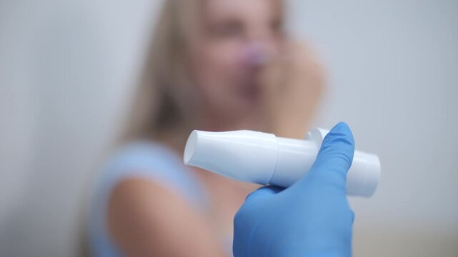 Doctor preparing spirometer for lung function test