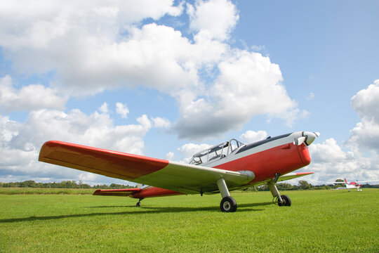 Single-engine sport light aircraft on a grass runway preparing to take off - shape and details changed