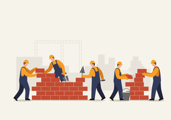 Fototapeta premium Construction workers building a brick wall together, demonstrating teamwork and construction techniques.