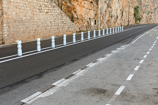 New Asphalt Road With Divider Columns and Segregated Bike Lane at French Riviera