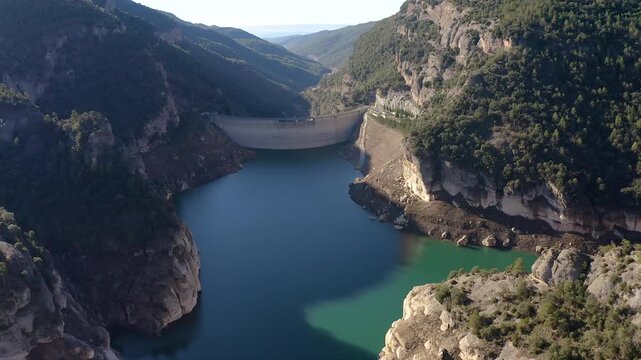Aerial view of the Llosa del Cavall dam, with a double-round arch, is 122 m high, was completed in 1997 and is located in a wooded and sparsely populated area called Llosa del Cavall, Spain.