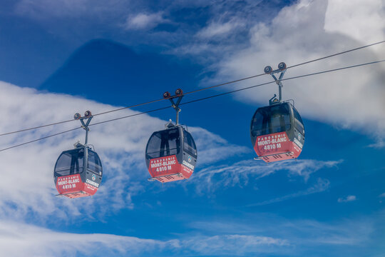 Chamonix, France - 07.07.2024: Cable car gondola in Chamonix Mont Blanc. Aiguille du Midi, Brevent and Valle Blanche Cable Car Telecabine Panoramic Mont-Blanc in French Alps mountain area