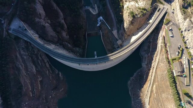 Aerial view of the Llosa del Cavall dam, with a double-round arch, is 122 m high, was completed in 1997 and is located in a wooded and sparsely populated area called Llosa del Cavall, Spain.