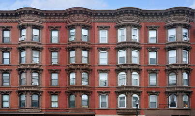 Fototapeta premium old apartment buildings with ornate roof cornice