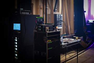 Professional broadcast control equipment with multiple monitors screens and audio mixing consoles...