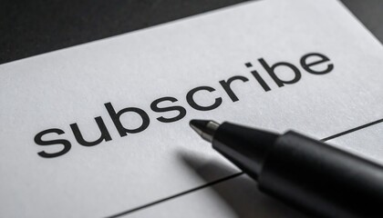 Close-up of a white paper with the word "subscribe