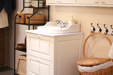 Cozy Bathroom with White Vanity and Wicker Baskets