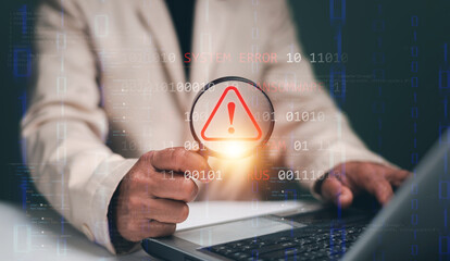 System error and warning alert. Businessman use laptop and holding magnifying glass with show red caution icon. Symbolizing data failure. Cyber threats. Perfect for tech issues. Error diagnostics.