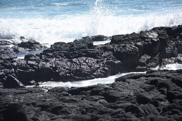 waves crashing on rocks