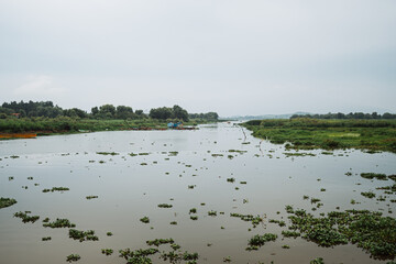 A lake in the mist, with a mystical, mysterious, and nostalgic feel, on a cloudy day in Mexico. Pátzcuaro, Michoacán.