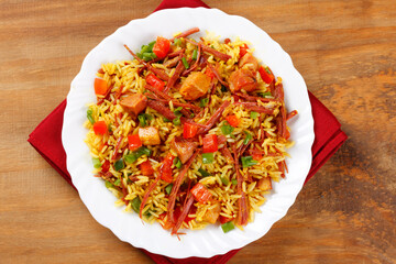 Arroz de Carreteiro, Carter's Rice, on a white plate, a typical dish from Southern Brazil with rice and dried meat