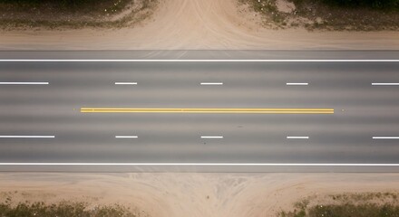 Aerial Perspective of a Straight Asphalt Road with Distinctive Lane Markings