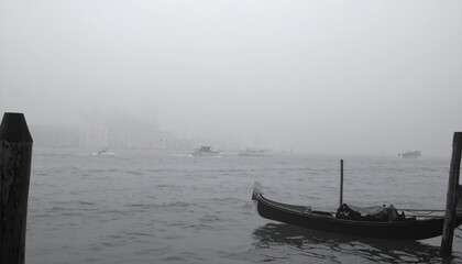 Obraz premium Gondola On A Venice Canal In Dense Fog Creating A Moody Black And White Atmosphere