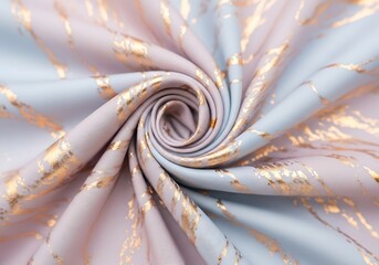 Elegant pastel fabric with golden accents in a swirling pattern creates a luxurious texture