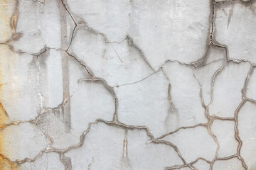 Cracked, grey plaster background concept