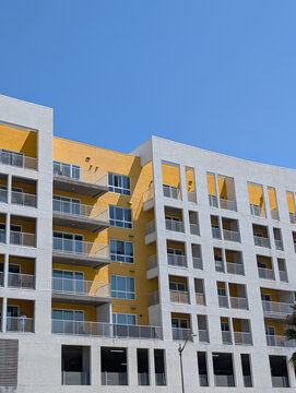 Sunny yellow modern apartment building