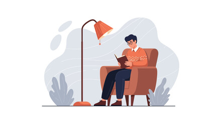 Man Reading A Book Relaxing In An Armchair Under A Lamp At Home