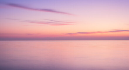 Obraz premium Dreamy pastel seascape with a tranquil horizon captures the gentle hues of dawn