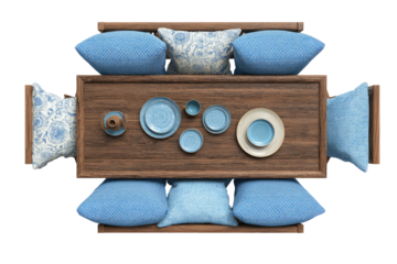 Overhead view of a wooden dining table with blue patterned cushions and various dishes