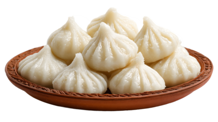 Traditional Indian Modak Sweets on a Terracotta Plate, Steamed Dumplings Offered During Ganesh Chaturthi Festival, Delicious Maharashtrian Delicacy