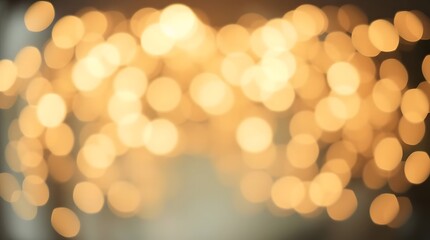 Obraz premium Warm golden bokeh background with shimmering out-of-focus lights. Abstract festive concept for holiday or celebration design.