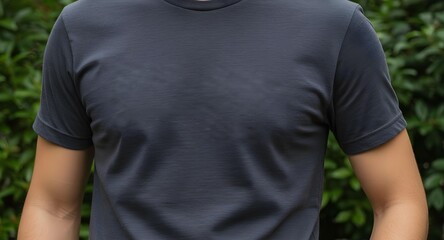Stylish dark gray t-shirt on a person, great for fashion and athletic apparel concepts and product displays