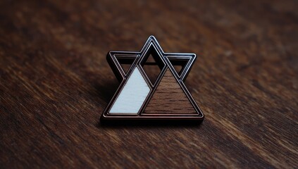 Wooden-and-metal, geometric pin on wood