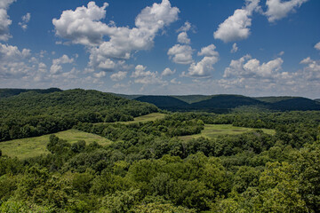 Rolling ozark hills on a sunny afternoon with trees © Nicholas