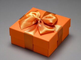 オレンジのリボンがかかったギフトボックス