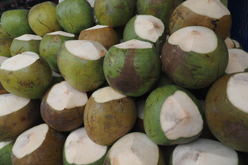 Fresh coconuts for sale at a local market in summer