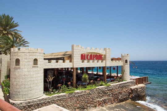 Dahab, Egypt - May 18, 2019: Al Capone seafood restaurant with castle-style design on Red Sea promenade