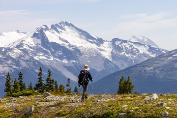 Hiker Exploring Alpine Terrain with Scenic Mountain Views in Whistler, BC, Canada