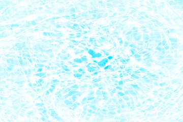Blue water with ripples on the surface. Defocus blurred transparent blue colored clear calm water surface texture with splashes and bubbles. Water waves with shining pattern texture background.