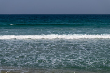 tranquil seascape with breaking waves