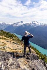 Man Enjoying Scenic View of Lake and Mountains in Whistler, BC, Canada