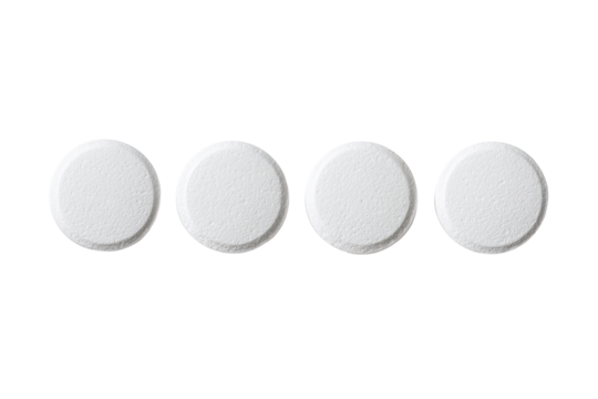 Four white, round tablets arranged in a horizontal row