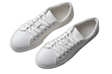 Pair of white canvas sneakers.  Overhead view, showing laces and soles