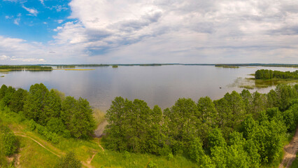 a large lake in a summer forest