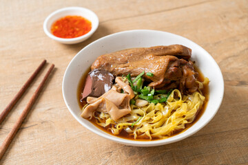 egg noodles with stewed and braised duck in brown soup