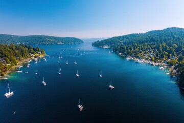 Obraz premium Aerial View of Sailboats on Deep Blue Water Surrounded by Lush Green Islands