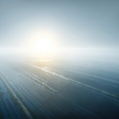 Fototapeta premium Aerial view of a Vast Agricultural Field Under a Misty Sky with Bright Sun